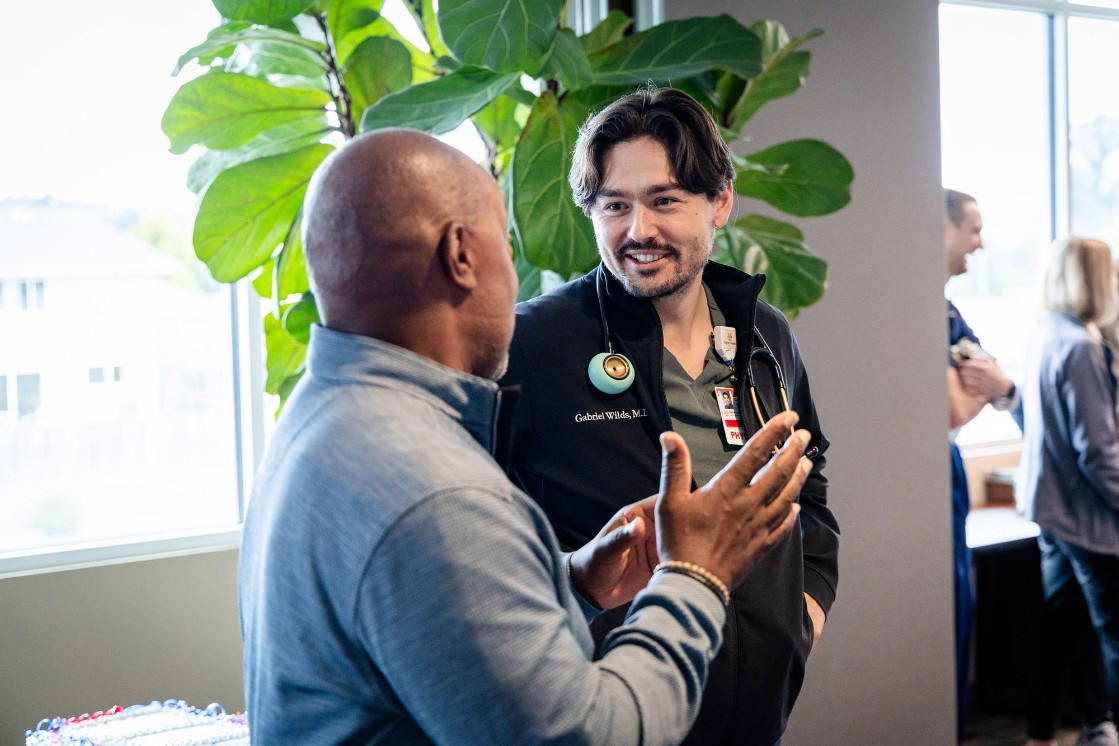 Gerald Sanders speaks with Dr. Gabriel Wilds, a member of his care team at Arroyo Grande Community Hospital's Acute Rehabilitation Unit, during a reunion Friday. The event was held to recognize his progress after experiencing a stroke in March.