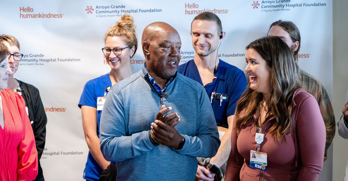 Gerald Sanders speaks with a member of his care team at Arroyo Grande Community Hospital's Acute Rehabilitation Unit during a reunion Friday. The event was held to recognize his progress after experiencing a stroke in March and to highlight National Rehabilitation Awareness Week. 