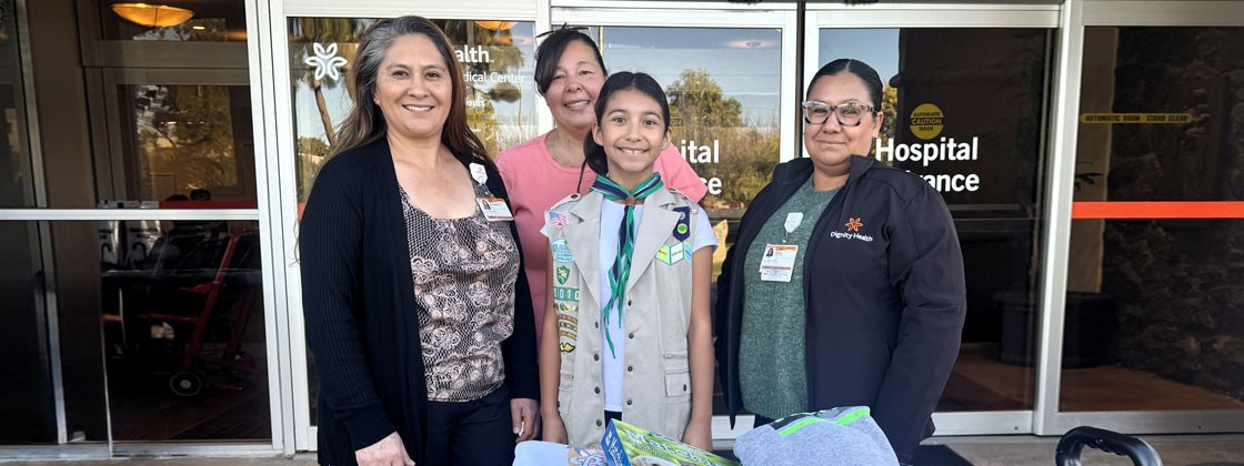 Janeth Ruiz and her mother Teresa pose with Dignity Health Community Educators Elizabeth Chavez de Perez, left, and Irene Castro, right, after donating jackets, sweatshirts, and toys to the Pediatric Closet at Marian Regional Medical Center.