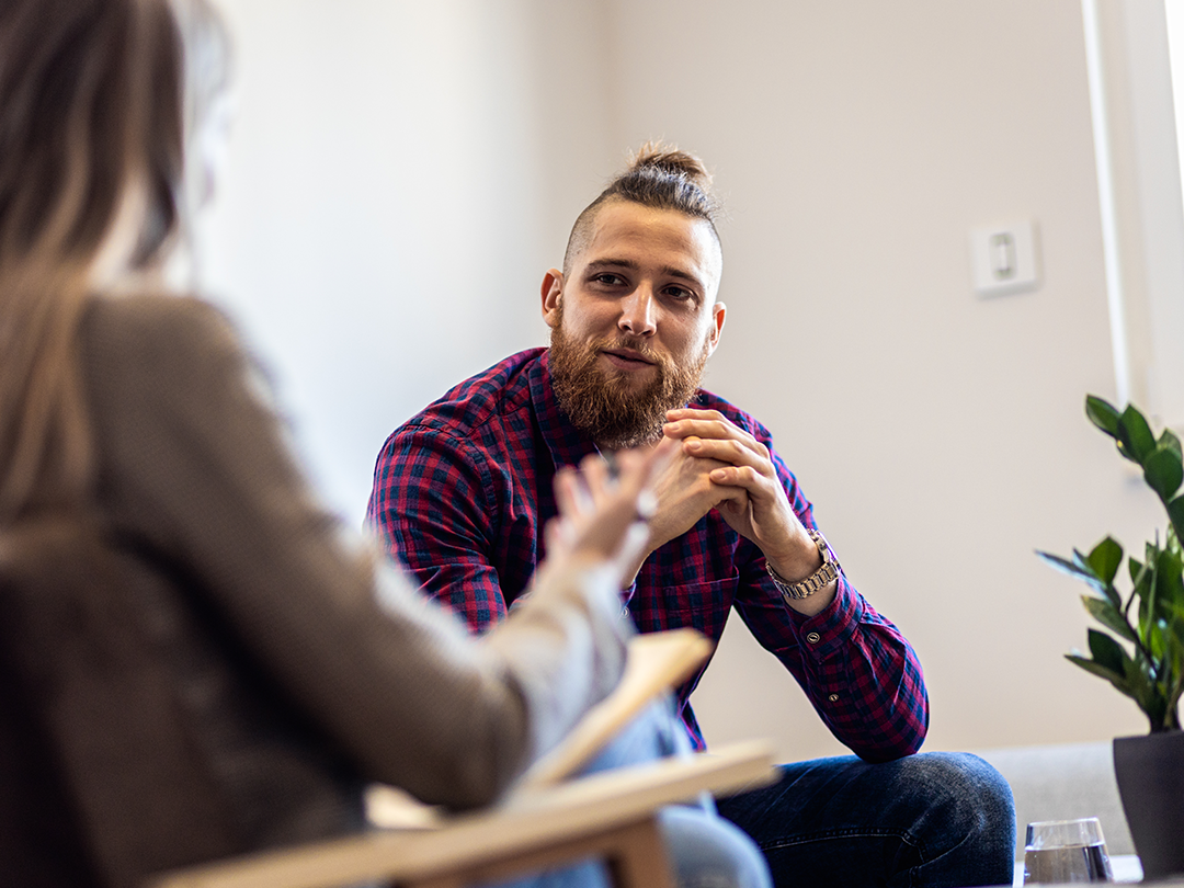 Male talking to therapist