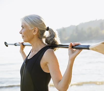 woman holding a paddle