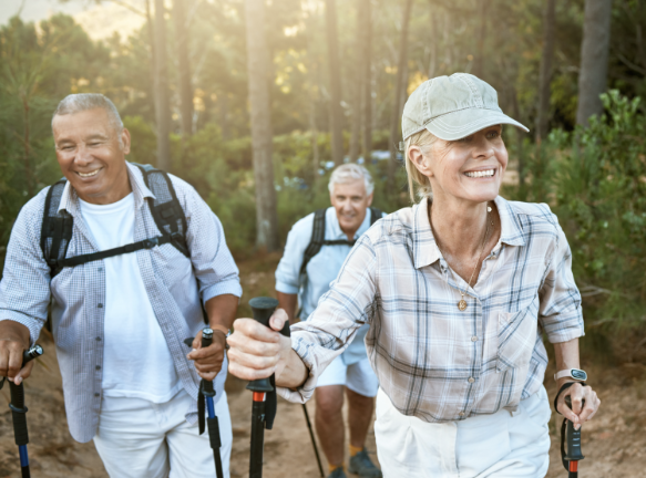 Older people hiking in the woods