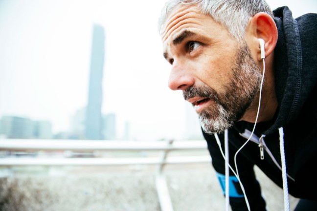 Senior man resting with earplugs