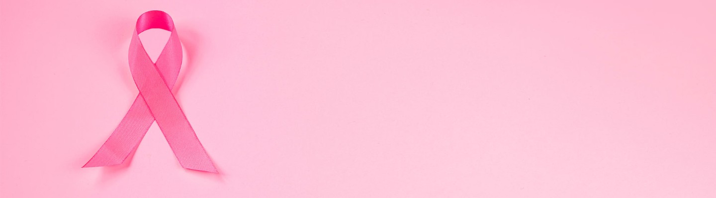 Pink ribbon on pink background